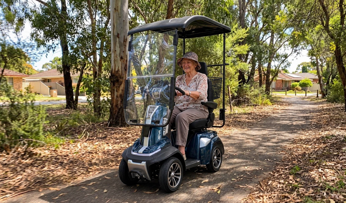 ROVA Elite canopy scooter with seat-mounted basket and crutch holder - wooded-path