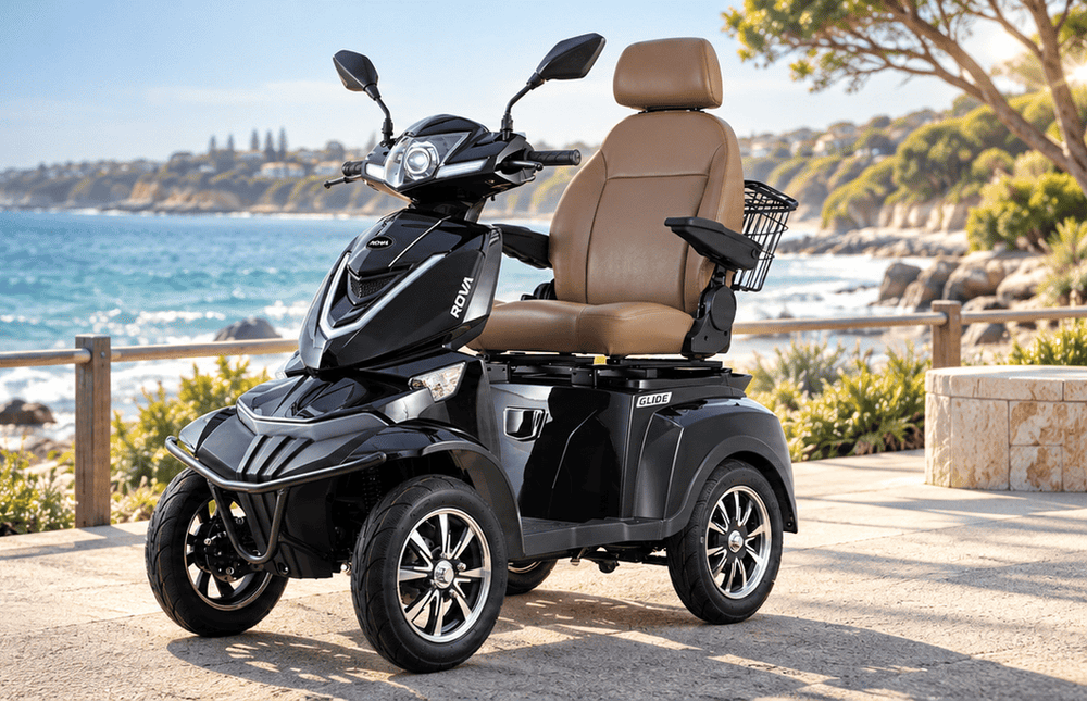 Black ROVA Glide scooter on a coastal promenade